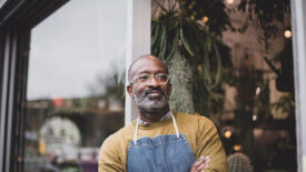 a man standing outside a store